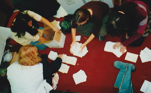 Emily, Shannon Martin, Dana Powell and Carol Isaacs organizing action cards Honor the Earth 2000